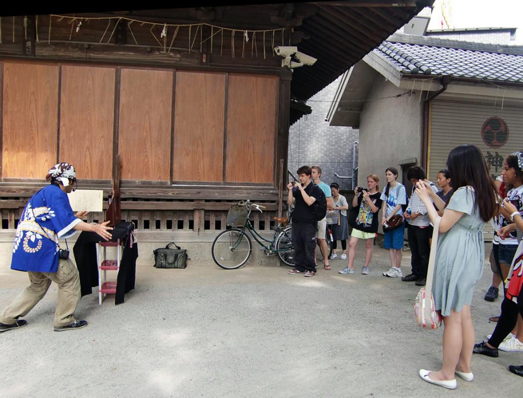 KCP students watching kamishibai (paper drama).