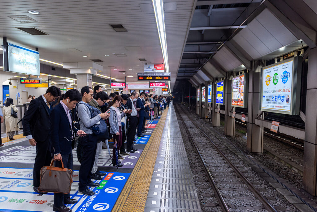 TOKYO, JAPAN - NOVEMBER 9, 2018: Tokyo Subway Metro Line and People Waiting Train